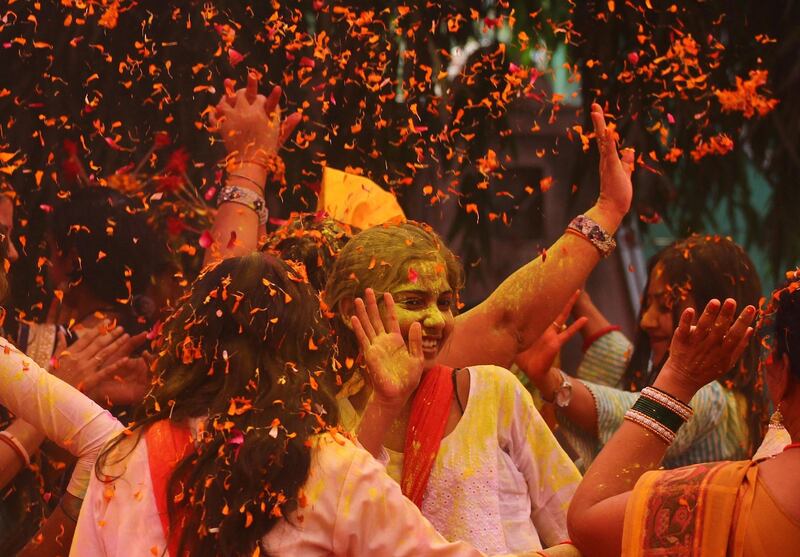 People celebrate Holi, the spring festival of colours, during an event by the Trishla Foundation, a non-profit organisation for cerebral palsy treatment, in Allahabad on March 6, 2020. AFP