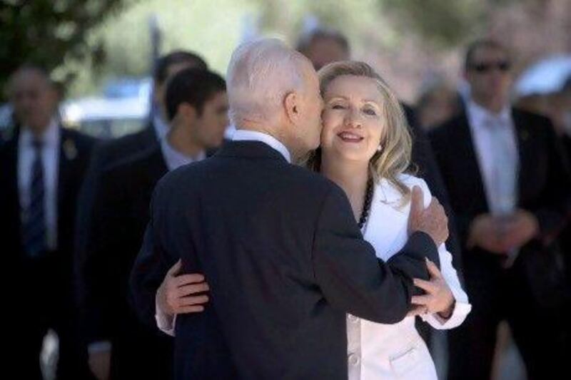 Israel's president Shimon Peres, left, welcomes US secretary of state Hillary Clinton to his Jerusalem residence..