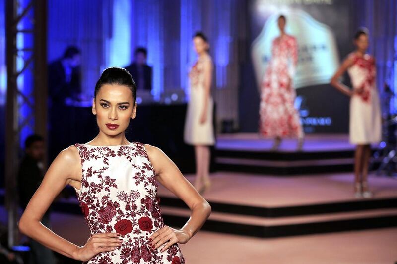 An Indian model presents a creation of designers Abraham and Thakore during the annual Blender's Pride Fashion Tour 2014 in Bangalore, India.  Manjunath Kiran/AFP