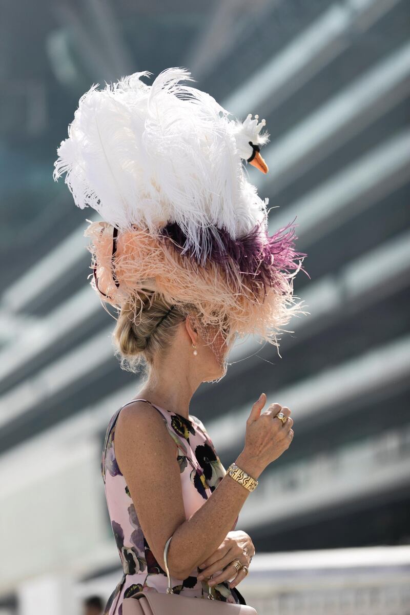 DUBAI, UNITED ARAB EMIRATES - MARCH 31, 2018. 

A woman wears a swan inspired hat at Dubai World Cup 2018.

(Photo by Reem Mohammed/The National)

Reporter: 
Section: NA