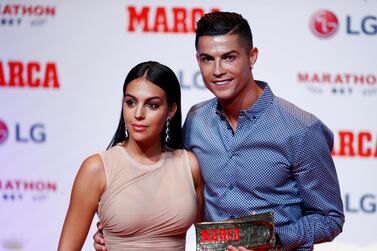 Soccer Football - Cristiano Ronaldo receives the MARCA Legend award - Reina Victoria Theater, Madrid, Spain - July 29, 2019 Cristiano Ronaldo poses with partner Georgina Rodriguez and the MARCA Legend award REUTERS/Juan Medina