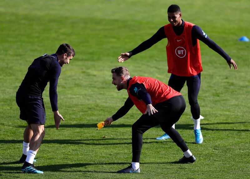 Left to right: England's Harry Winks, Jordan Henderson and Marcus Rashford. Reuters