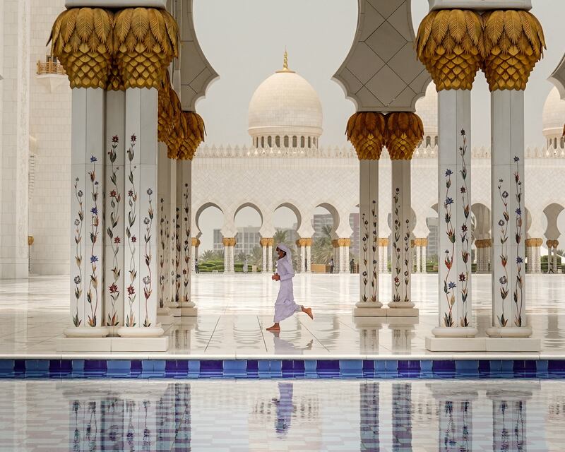 A child runs ahead of Friday prayer at the Sheikh Zayed Grand Mosque in Abu Dhabi, United Arab Emirates, July 15, 2022.  REUTERS / Amr Alfiky     TPX IMAGES OF THE DAY