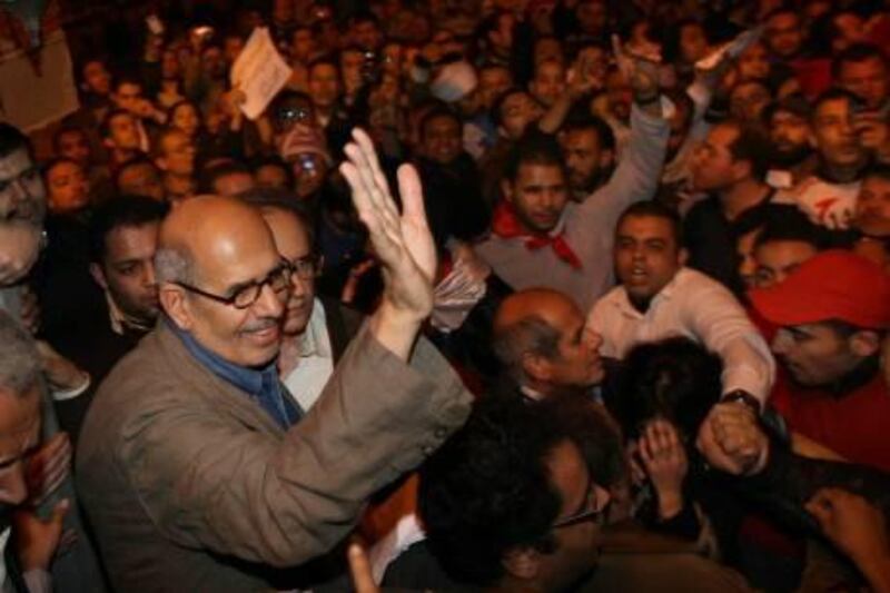 CAIRO, EGYPT - JANUARY 30:  Opposition leader Mohamed ElBaradei waves to supporters in Tahrir Square on January 30, 2011 in Cairo, Egypt. Cairo remained in a state of flux and marchers continued to protest in the streets and defy curfew, demanding the resignation of Egyptian president Hosni Mubarek. As President Mubarak struggles to regain control after five days of protests he has appointed Omar Suleiman as vice-president. The present death toll stands at 100 and up to 2,000 people are thought to have been injured during the clashes which started last Tuesday. Overnight it was reported that thousands of inmates from the Wadi Naturn prison had escaped and that Egyptians were forming vigilante groups in order to protect their homes.   (Photo by Peter Macdiarmid/Getty Images) *** Local Caption ***  GYI0063258641.jpg