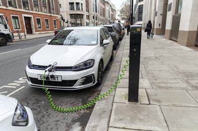 An electric car is seen charging at a charging point on the street in Westminster, central London, UK on January 11, 2019 (photo by Vickie Flores/In Pictures via Getty Images Images)