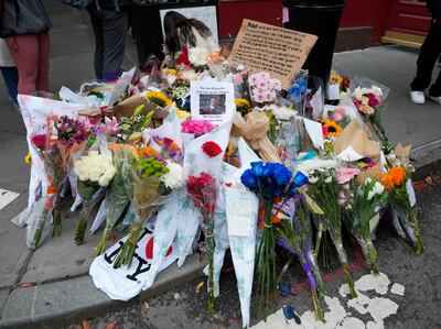 A makeshift memorial for Matthew Perry outside the building shown in exterior shots of Friends. AP