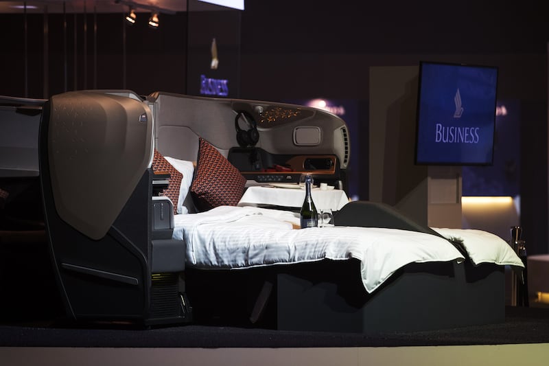 Business class passenger seats, reclined in a full-flat bed configuration, stand on display during the unveiling of the new cabins for the Singapore Airlines Ltd. Airbus SE A380 aircraft in Singapore, on Thursday, Nov. 2, 2017. Singapore Air, the first carrier to put a double bed in its cabins, is spending $850 million to refit all its A380 jets to take airborne luxury up another notch. Photographer: Nicky Loh/Bloomberg