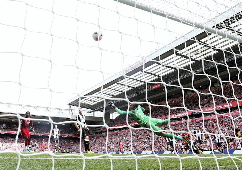 LIVERPOOL, ENGLAND - SEPTEMBER 14: Sadio Mane of Liverpool scores his team's first goal past Martin Dubravka of Newcastle United during the Premier League match between Liverpool FC and Newcastle United at Anfield on September 14, 2019 in Liverpool, United Kingdom. (Photo by Jan Kruger/Getty Images)