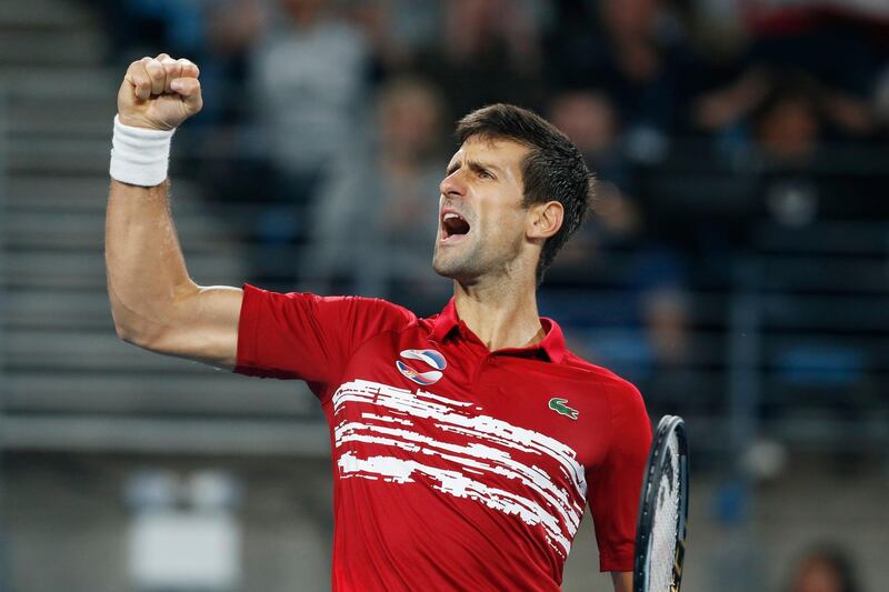 Novak Djokovic of Serbia reacts to winning a point against Rafael Nadal of Spain during their ATP Cup tennis match in Sydney, Sunday, Jan. 12, 2020. (AP Photo/Steve Christo)