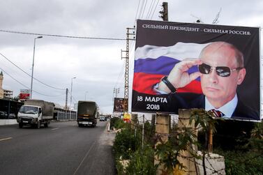 An election poster for Russian president Vladimir Putin in Tyre, southern Lebanon.Moscow is using its state-run oil major as tool of foreign policy in the Middle East. AFP