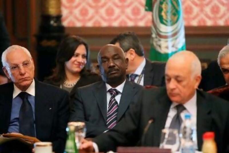 The Sudanese general Mohammed Al Dabi, centre, stepped down as the head of the mission to Syria yesterday.
