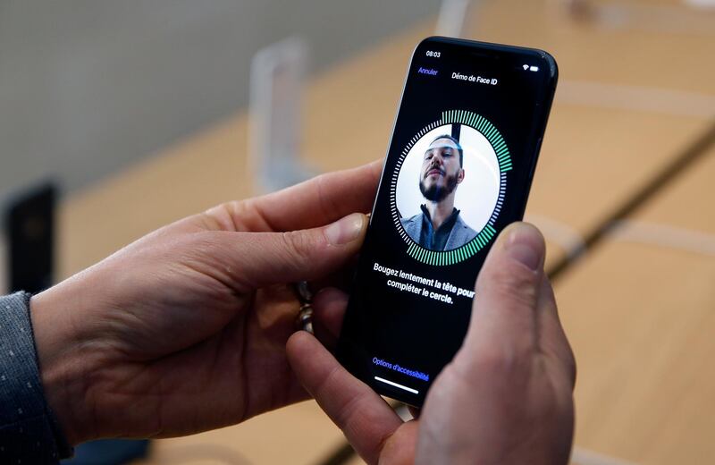 PARIS, FRANCE - NOVEMBER 03:  A customer uses the new face-recognition software on the Apple iPhone X, the new model of Apple smartphone at the Apple Store Saint-Germain on November 3, 2017 in Paris, France. Apple's latest iPhone X features face recognition technology, a large 5.8-inch edge-to-edge high resolution OLED display and better front and back cameras with optical image stabilisation.  (Photo by Chesnot/Getty Images)