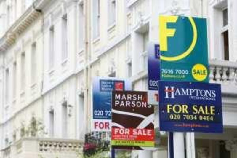 Property for sale signs are grouped together outside apartments for sale in London, U.K., on Tuesday, June 10, 2008.  HBOS Plc, the U.K.'s biggest mortgage lender, said home prices will fall as much as 9 percent this year, more than it earlier forecast, and bad home loans rose 17 percent. Photographer: Suzanne Plunkett/Bloomberg News
