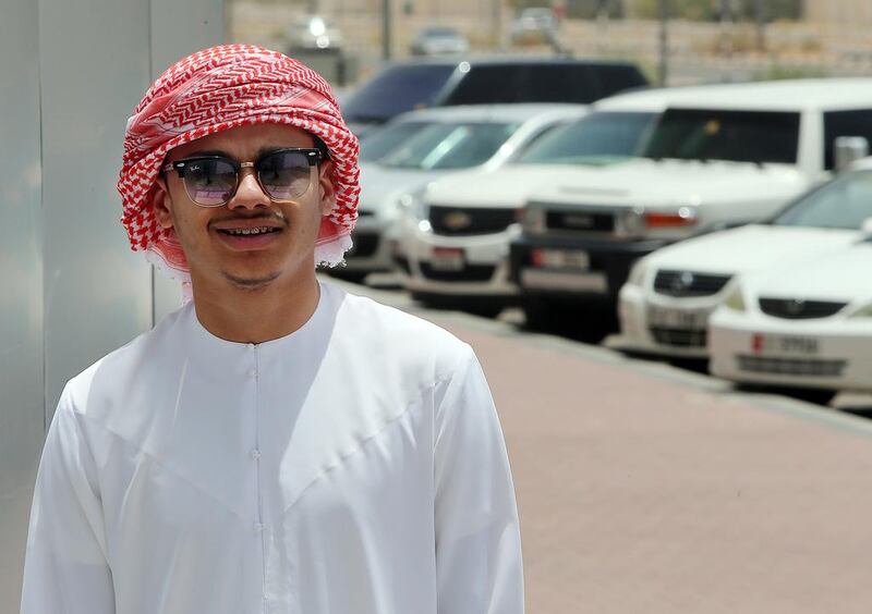 After seeing a car flip over at high speed in Al Ain, 18-year-old Mohammed Al Nuaimi pulled over and helped to rescue six young women  who were trapped inside the vehicle. Satish Kumar / The National 