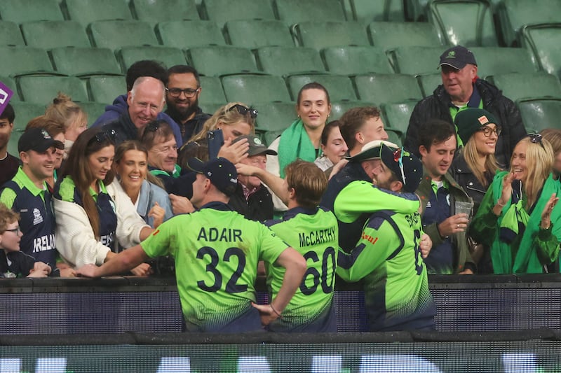 Ireland players celebrate with fans following their win over England at the T20 World Cup in Melbourne. Ireland won by five runs after rain stopped play. AP