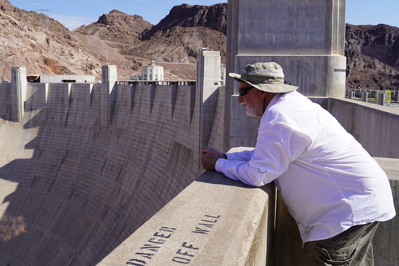 Professor David Kreamer of the University of Nevada Las Vegas looks out over the Hoover Dam.