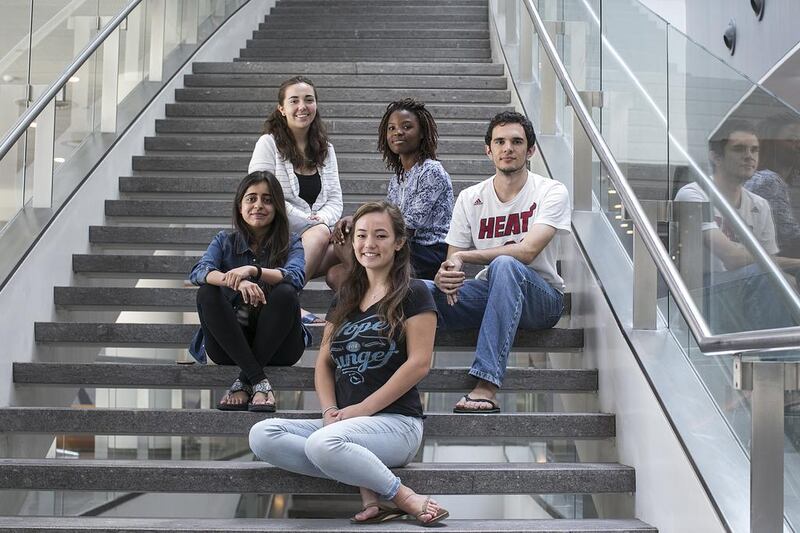 Katie Sheng (centre front) and from right, Guillermo Schlamp, Vongai Mlambo, Katarina Holtzapple, and Hafsa Ahmed are among the 60 NYUAD students who are trying to help Pakistani students pay school fees. Mona Al Marzooqi/ The National / May 7, 2017