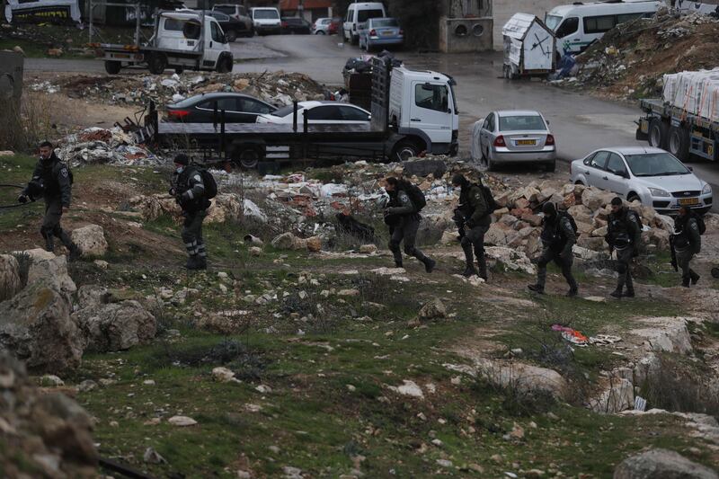 Israeli officers walk in the Sheikh Jarrah area. AFP