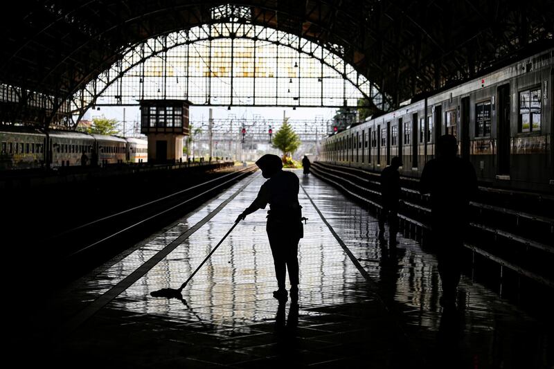 A worker sweeps the floor of the Tanjung Priok station in Jakarta, Indonesia.  Reuters