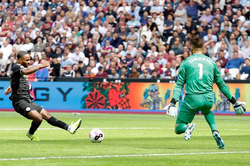 Sterling slides home City's second goal. AP Photo