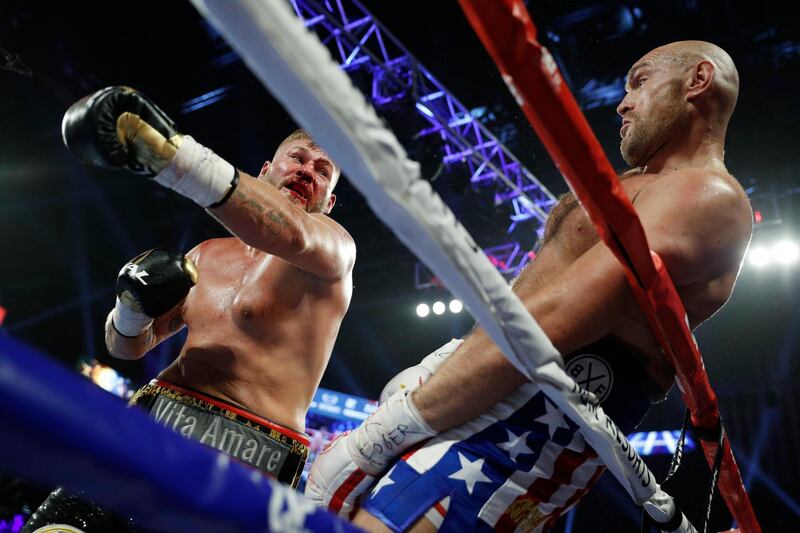 Tyson Fury, of England, right, dodges a punch by Tom Schwarz, of Germany, during a heavyweight boxing match in Las Vegas. AP Photo