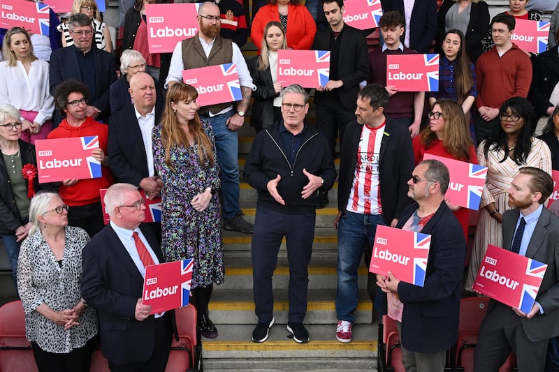 Mr Starmer speaks to Labour supporters at Harlow Town Football Club's stadium in Essex. Getty Images