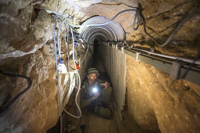 An Israeli army officer in a tunnel used by Palestinian militants for cross-border attacks. AP