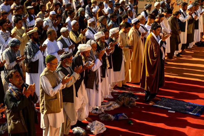 Afghan Muslim devotees offer prayers at the start of the Eid Al Fitr holiday in Herat. AFP