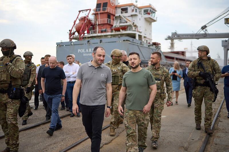 Ukrainian President Volodymyr Zelenskyy visits a port in Chornomork, near Odesa, during the loading of grain on to a Turkish ship on Friday. AP