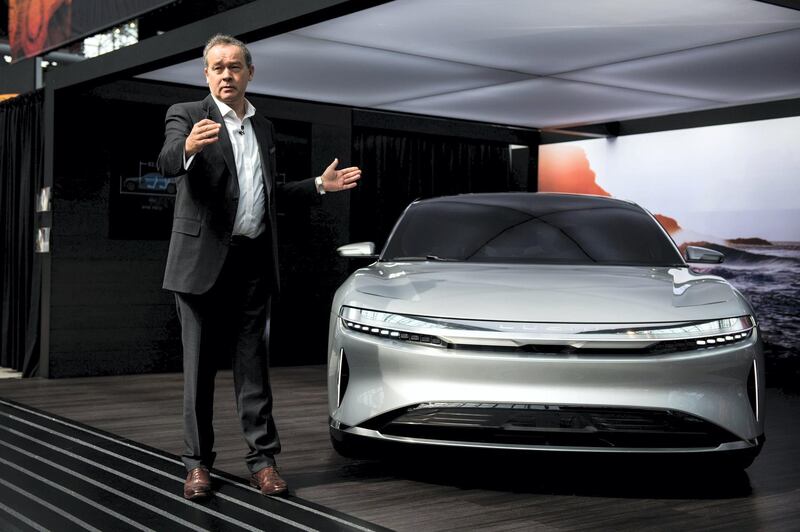 Peter Rawlinson, chief technology officer for Lucid Motors Inc., speaks next to the company's Air alpha prototype vehicle during the 2017 New York International Auto Show (NYIAS) in New York, U.S., on Thursday, April 13, 2017. The New York International Auto Show, North America's first and largest-attended auto show dating back to 1900, showcases an incredible collection of cutting-edge design and extraordinary innovation. Photographer: Mark Kauzlarich/Bloomberg