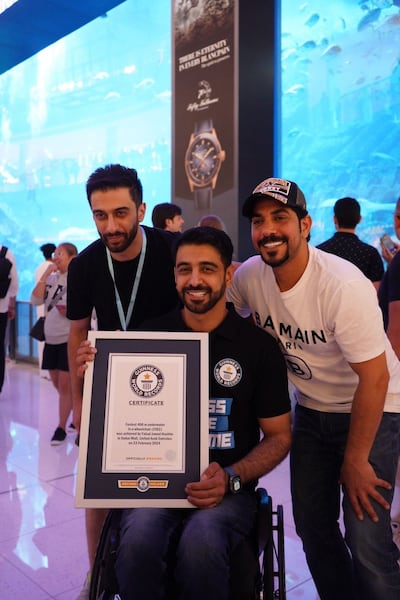 Faisal Al Mosawi celebrates with his Guinness World Record certificate. Photo: Wam