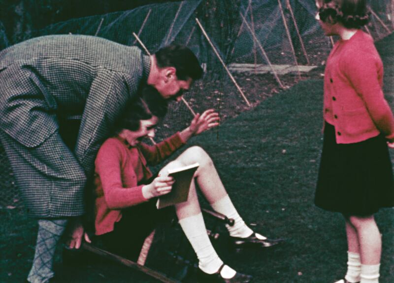 Princess Margaret and Princess Elizabeth with their father King George VI at Royal Lodge in Windsor in 1940.