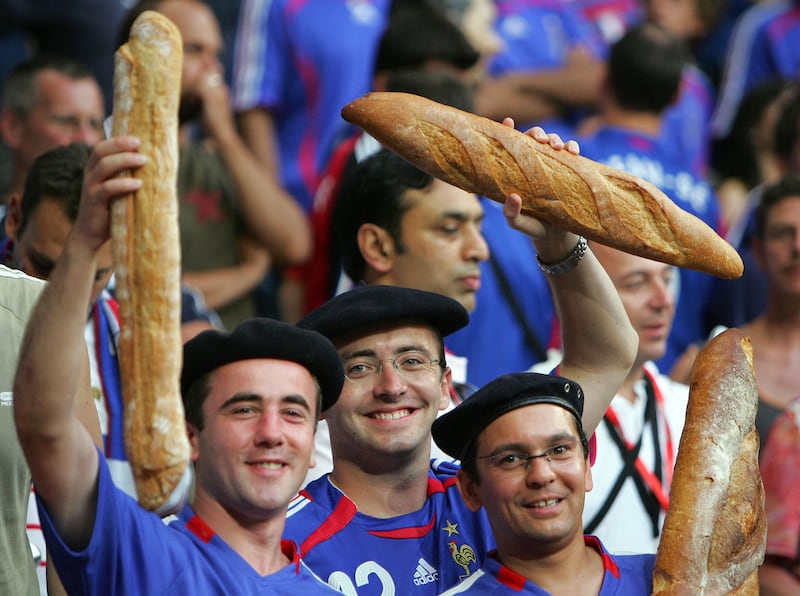French supporters holding baguettes prior to the World Cup 2006 semi-final football match. AFP