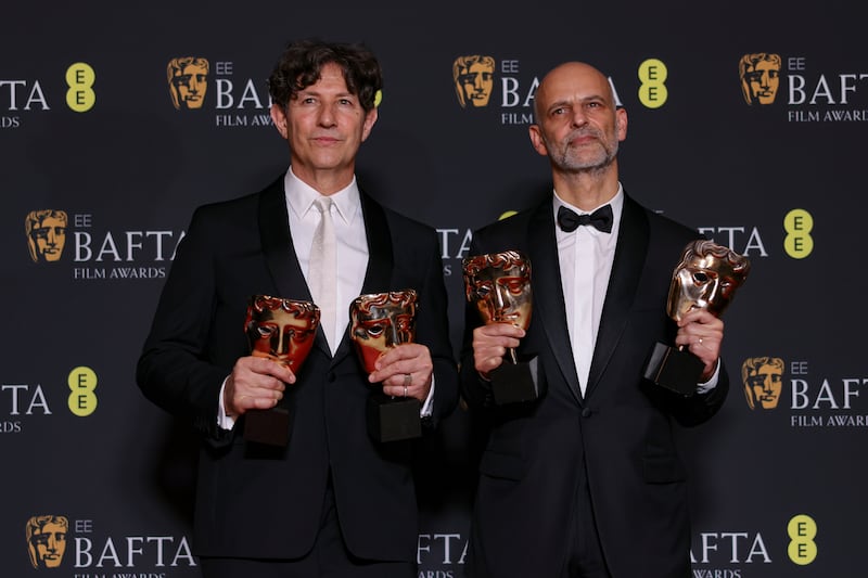 Director Jonathan Glazer, left, and producer James Wilson, winners of the Outstanding British Film and Film not in the English Language awards for The Zone of Interest. AP