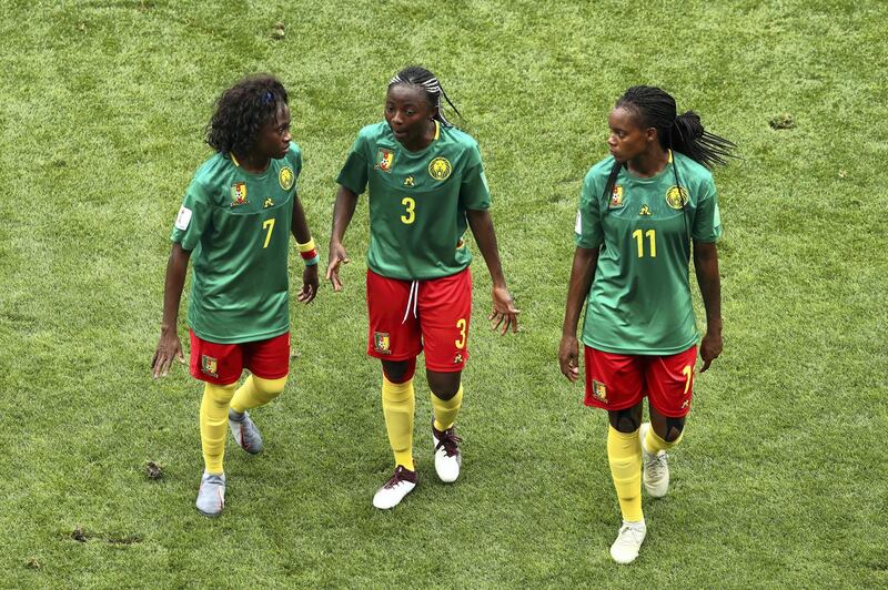 VALENCIENNES, FRANCE - JUNE 23: Gabrielle Aboudi Onguene of Cameroon consoles Ajara Nchout during the 2019 FIFA Women's World Cup France Round Of 16 match between England and Cameroon at Stade du Hainaut on June 23, 2019 in Valenciennes, France. (Photo by Robert Cianflone/Getty Images)