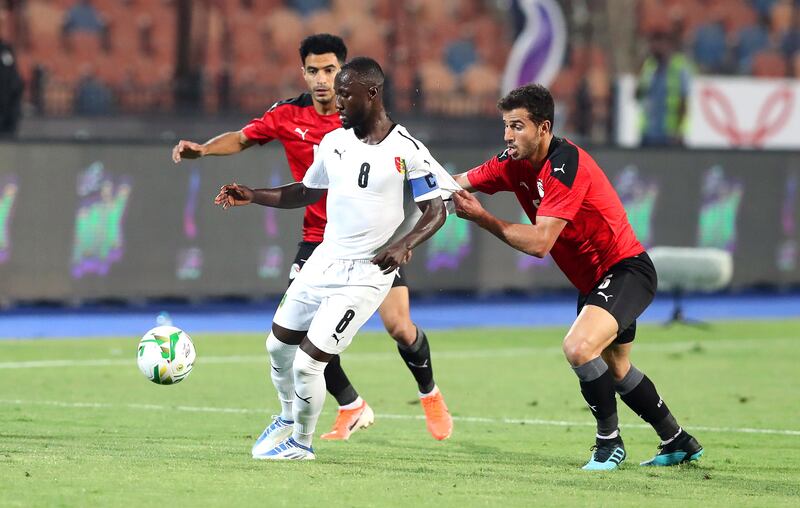 Naby Keita attempts to control the ball under pressure from Omar Gaber and Hamdy Fathy. EPA