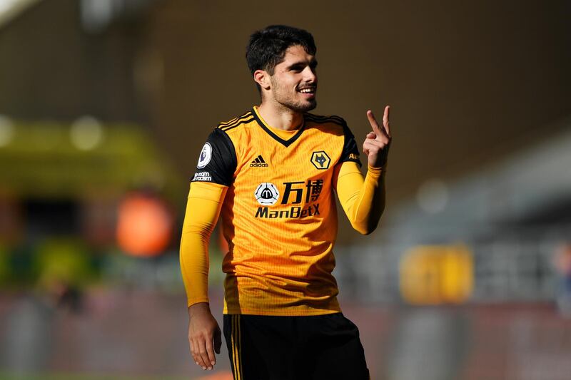 WOLVERHAMPTON, ENGLAND - OCTOBER 04: Pedro Neto of Wolverhampton Wanderers celebrates after scoring his sides first goal during the Premier League match between Wolverhampton Wanderers and Fulham at Molineux on October 04, 2020 in Wolverhampton, England. Sporting stadiums around the UK remain under strict restrictions due to the Coronavirus Pandemic as Government social distancing laws prohibit fans inside venues resulting in games being played behind closed doors. (Photo by Stu Forster/Getty Images)