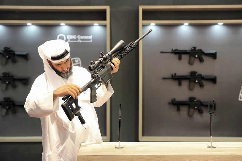 ABU DHABI , UNITED ARAB EMIRATES , SEP 12  ��� 2017 : Visitor looking guns at the Caracal stand on the first day of the ADIHEX 2017 held at  Abu Dhabi National Exhibition Centre in Abu Dhabi. ( Pawan Singh / The National ) Story by Anna
