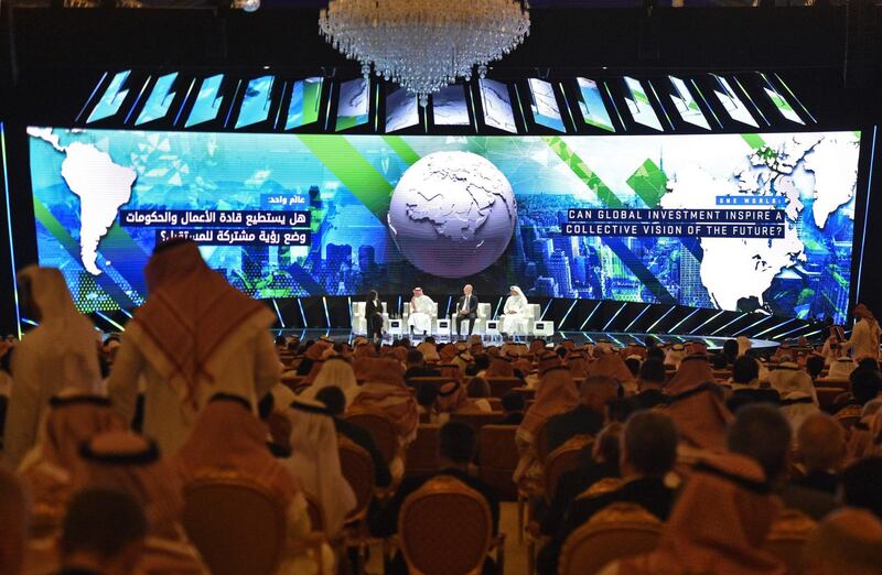 From left to right, Lubna Olayan, CEO and Deputy Chairperson Olayan Financing, Yasir Al Rumayyan, Saudi managing director of Public investment Fund, Kirill Dmitriev, CEO of Rusian Direct Investment Fund and Khaldoon Al Mubarak, managing director and CEO of Mubadala Development Company, speaking at  the opening ceremony. AFP