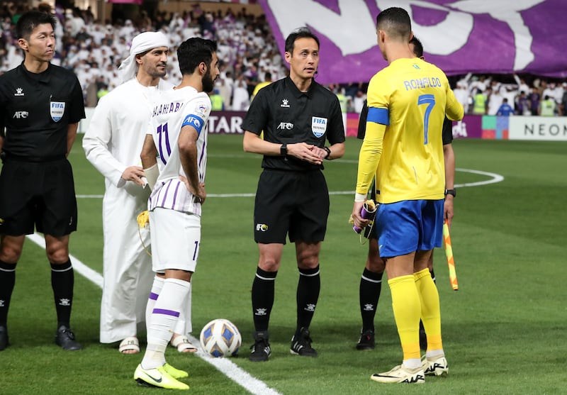 Al Nassr's captain Cristiano Ronaldo during the toss with Al Ain captain Bandar Al Ahbabi before kick-off.