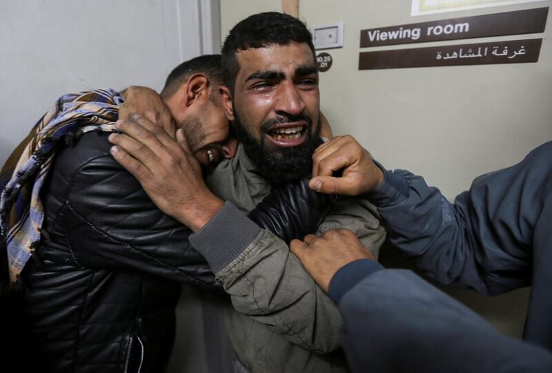Relatives of a Palestinian teenager who was killed near the border fence, mourn at the hospital in the southern Gaza Strip November 29, 2019. REUTERS/Ibraheem Abu Mustafa