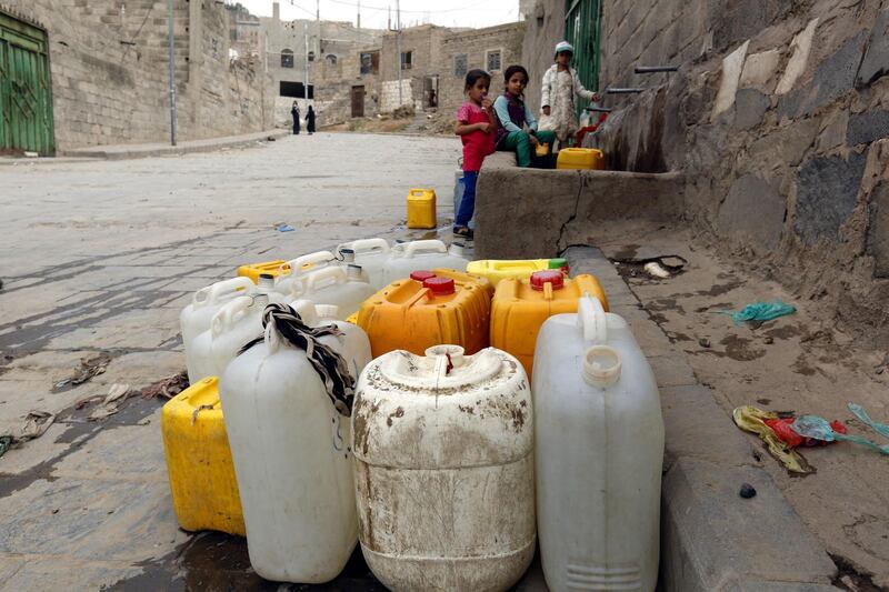 Children fetch water from a donated source in Sanaa, Yemen.  EPA
