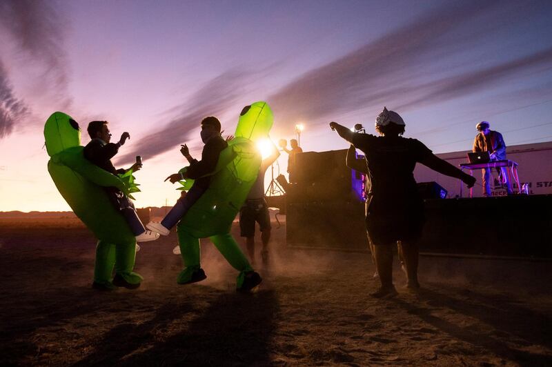 People in costume dance during a DJ set at 'Alienstock' in Rachel, Nevada, USA. Starting as a joke, the 'Storm Area 51' event transformed into a gathering for alien believers, with music and attractions held in several places around Area 51.  EPA