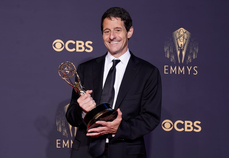 Bill Wrubel, poses for a photo with the award for Outstanding Comedy Series for 'Ted Lasso'. AP