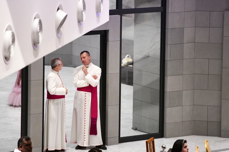 Priests and worshippers wait for the Pope. Khushnum Bhandari / The National