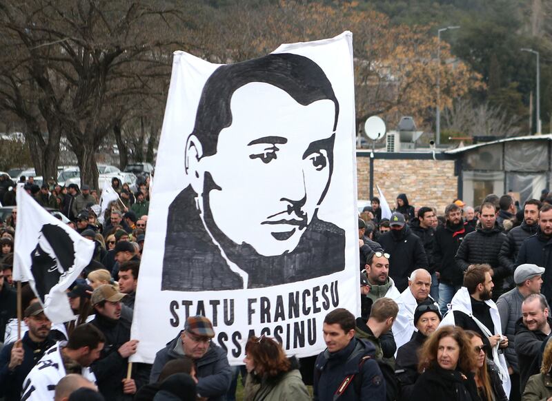 Protesters gather in Corsica to pay tribute to Yvan Colonna after the attack this month. AFP