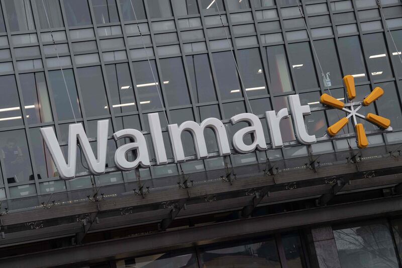 (FILES) In this file photo taken on March 1, 2019 the Walmart logo is seen on a store in Washington, DC. International retail giant Walmart agreed to pay $282 million to settle charges over potentially illegal payments to foreign officials in Brazil, China, India and Mexico, the US Securities and Exchange Commission announced on June 20, 2019. The SEC said the company failed to operate an effective anti-corruption program to comply with US law for more than a decade while it pursued international growth, and "repeatedly failed to take red flags seriously."Walmart agreed to pay $144 million to settle the SEC investigation, and $138 million to settle a parallel criminal probe by the Justice Department, the SEC said in a news release.
 / AFP / NICHOLAS KAMM
