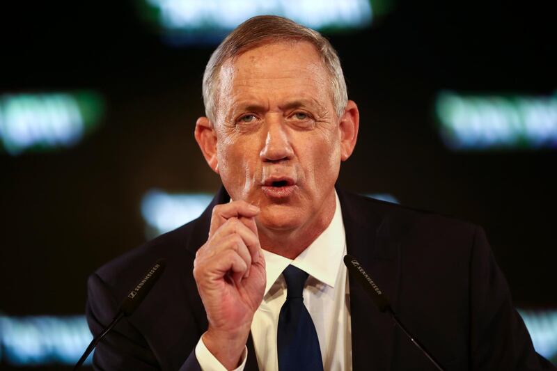 FILE - In this Tuesday, Jan. 29, 2019, file photo, former Israeli Chief of Staff Benny Gantz speaks at the official launch of his election campaign in Tel Aviv, Israel. Gantz, the leading challenger to Israel Prime Minister Benjamin Netanyahu, said in a published interview Wednesday, Feb. 6, 2019, that Israel should "find a way" to end its control over the Palestinians. (AP Photo/Oded Balilty)