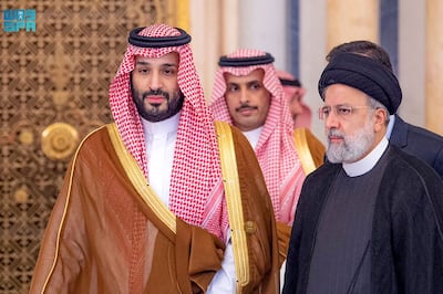 Saudi Crown Prince Mohammed bin Salman (L) and Iran's president Ebrahim Raisi (R) in Riyadh. Saudi Press Agency / AFP