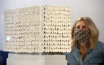 A gallery assistant poses as she looks at "Improntas (Imprint)" by Teresa Margolles, one of six artworks shortlisted as the next design for the Fourth Plinth at Trafalgar Square, on display inside the National Gallery in London, Britain, May 24, 2021. REUTERS/Hannah McKay